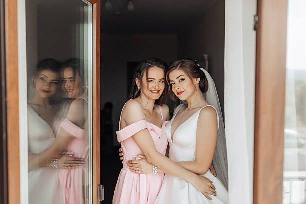 istock Two women, one wearing a wedding dress 2211913287