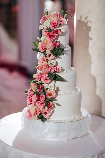 istock A white cake with pink flowers on it 2211913356