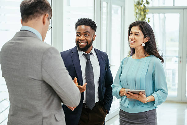 istock Multicultural corporate business people working in modern bright office on laptops and tablets 2211914084