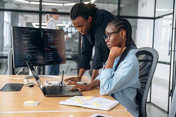istock Side view, sitting. Business people are working in the office 2211914237