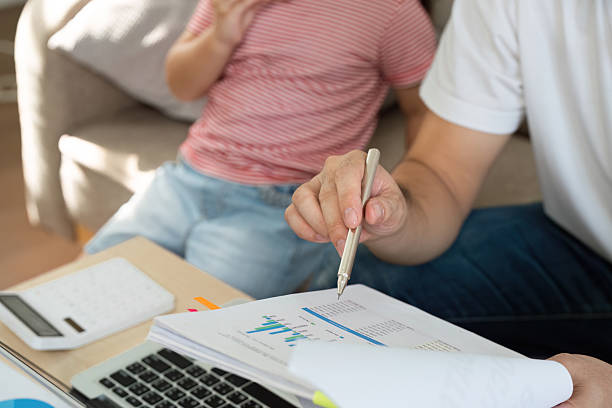 Multitasking and Family Time. A parent balances work tasks while engaging with their child, showcasing the challenges of remote work and family dynamics.