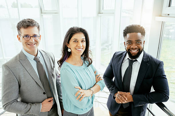 istock Multicultural corporate business people working in modern bright office with high windows 2211915104