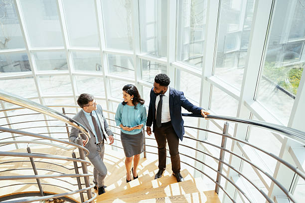 istock Multicultural corporate business people working in modern bright office with high windows 2211915152