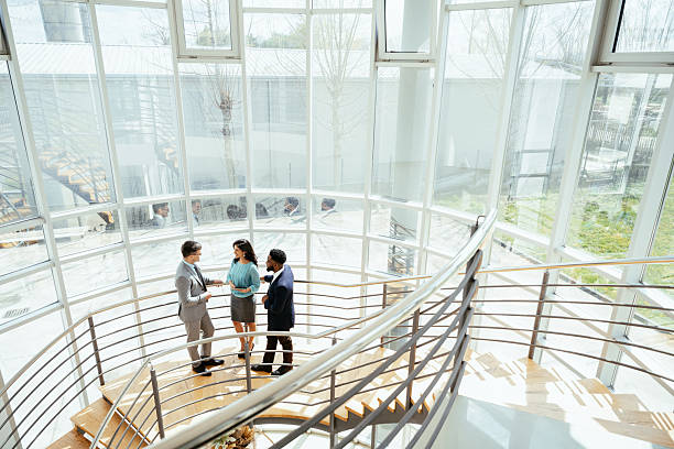 istock Multicultural corporate business people working in modern bright office with high windows 2211915169