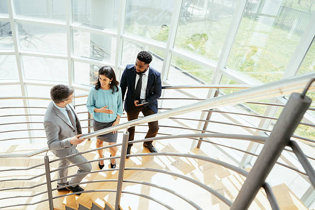 istock Multicultural corporate business people working in modern bright office with high windows 2211915183