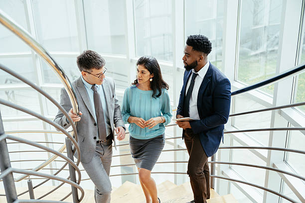istock Multicultural corporate business people working in modern bright office with high windows 2211915193
