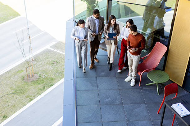 istock Team brainstorming and collaboration on a terrace during a sunny afternoon in a modern setting 2211917901