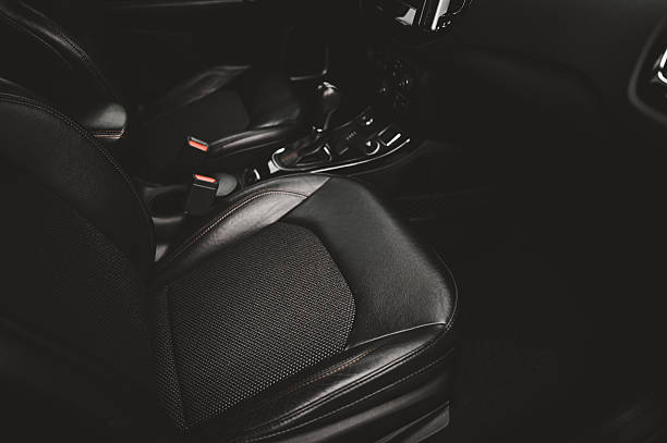 istock Modern car interior showing leather and cloth seats and dashboard 2211917968