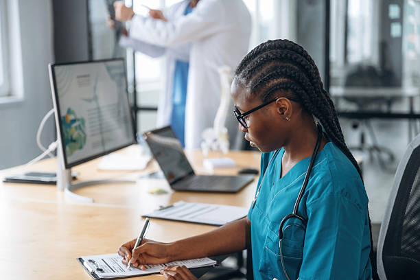 istock Signing the document. Doctors are working in the office 2211922126