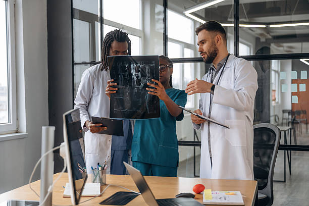 istock Examining the x-ray. Doctors are working in the office 2211923055