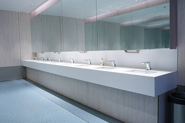 istock Clean and simple public toilet sink 2211924616