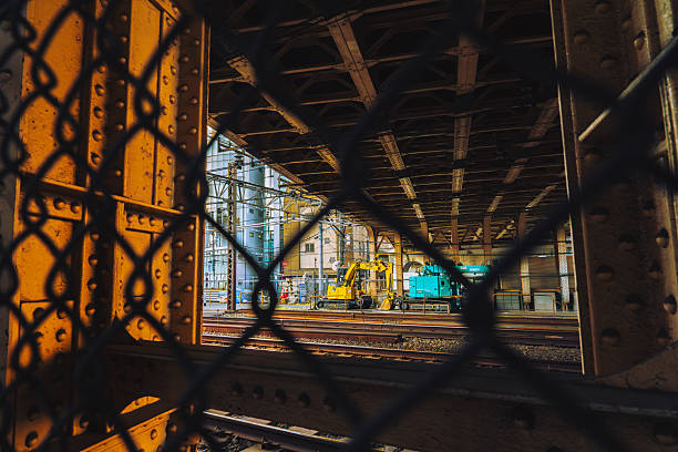 I really like this combination of the iron bridge, excavator, and rusty fence.