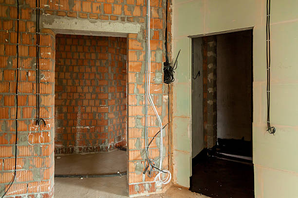istock Apartment interior under renovation with exposed brick walls 2211928372