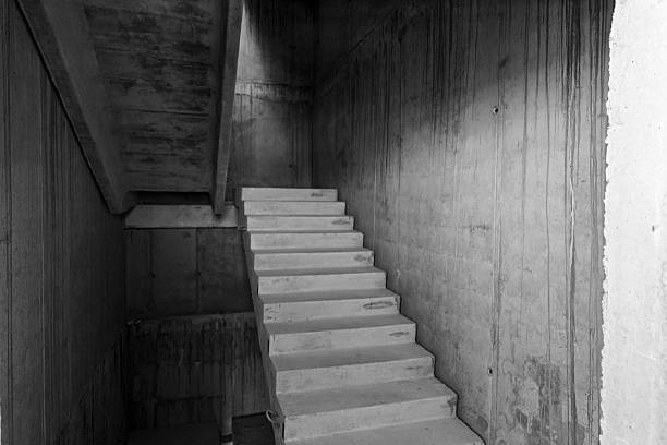 istock Concrete staircase in unfinished building 2211930047