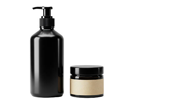 istock Isolated Black Cosmetic Bottles with Pump and Label 2211931483