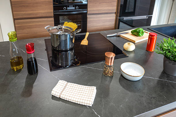 A man Cooks breakfast at home. He pours oil into the pan and starts frying