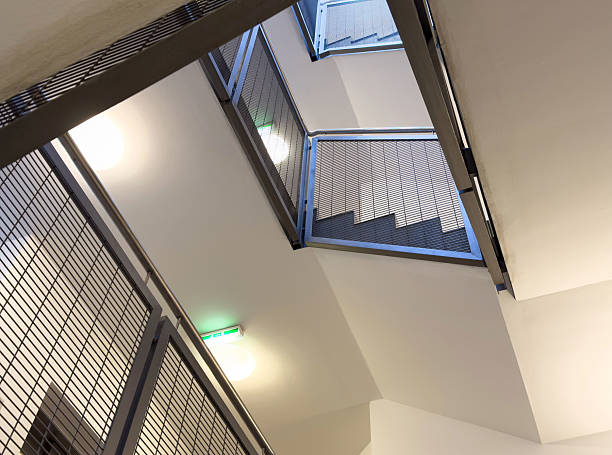 istock Interior modern staircase with metal railings and geometric design 2211939014