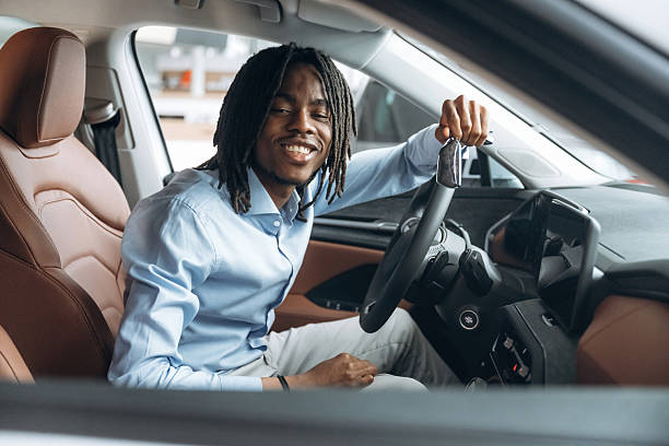 istock Man in shirt is in the modern car 2211941425