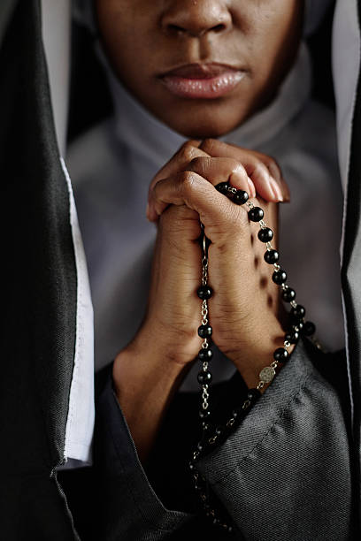 istock Praying Hands of Nun 2211942686