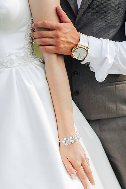 istock A couple is posing for a picture with their hands around each other 2211946965