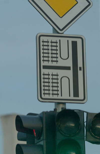 istock Traffic Signal along with a Road Sign Clearly Indicating an Intersection 2211948292