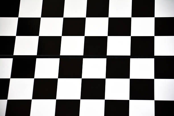 istock Chessboard on the wooden table. Black chess board game. Black and white chess pieces. Playing chess 2211948379