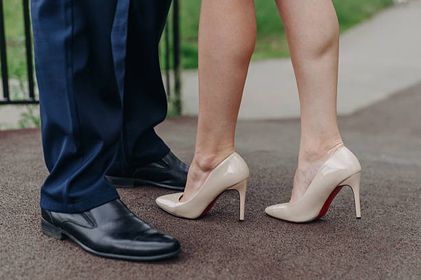 istock legs in black boots and heels 2211949756