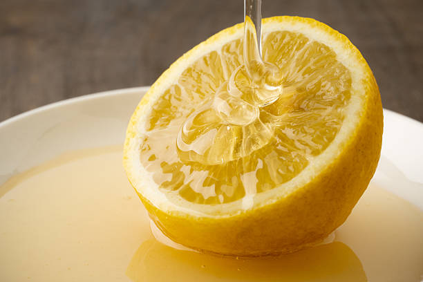 Close-up of lemon drizzled with honey