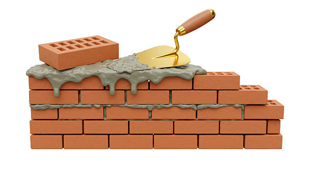 istock Isolated Construction of Brick Wall with Trowel 2211952502