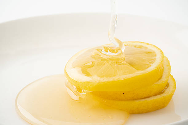 istock Close-up of lemon drizzled with honey 2211952568