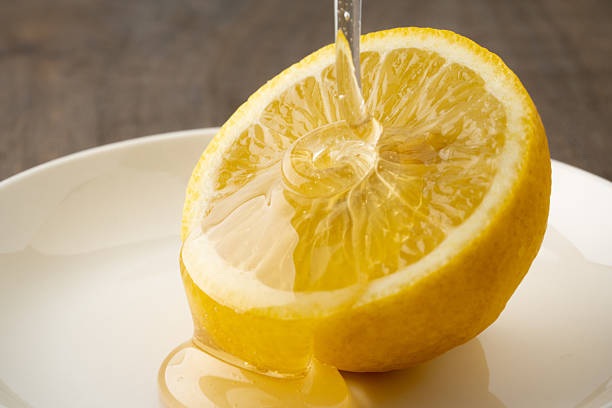 istock Close-up of lemon drizzled with honey 2211952618