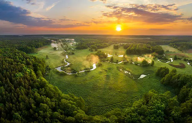 Beautiful spring morning over the forest and river - drone aerial view Beautiful spring morning over the forest and river - drone aerial view