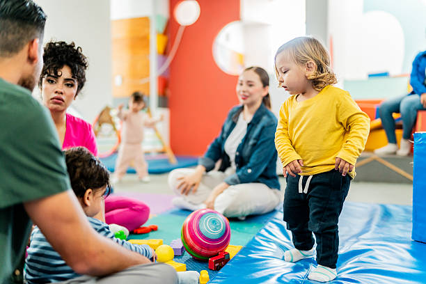 istock Young parent talking to therapist while kids playing on parents support group 2211957066