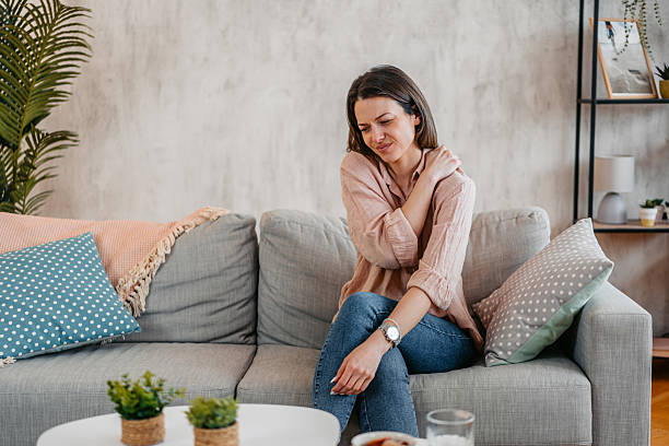 istock Young Woman Having A Shoulder Ache At Home 2211961342
