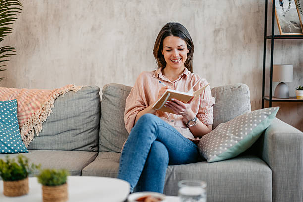 istock Young Woman Writing In A Diary At Home 2211961476