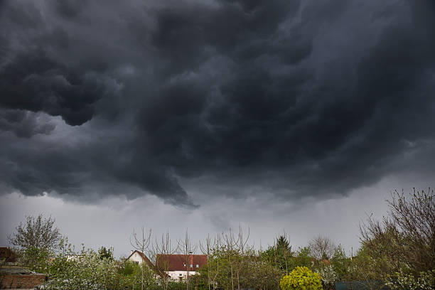 istock Dramatic dark sky and clouds background. Black sky before thunder storm and rain. Background for death, sad, grieving or depression 2211963405