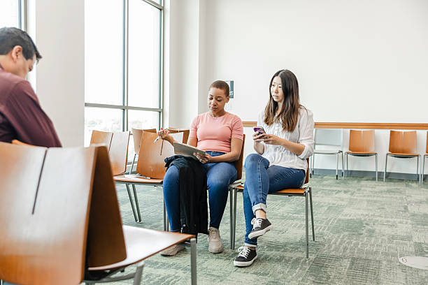 istock Two Women Working Together on a Project in a Waiting Room 2211963527