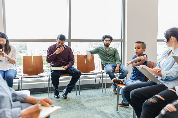 istock Multiracial Group Therapy Session: Diverse Patients & Therapist 2211963588