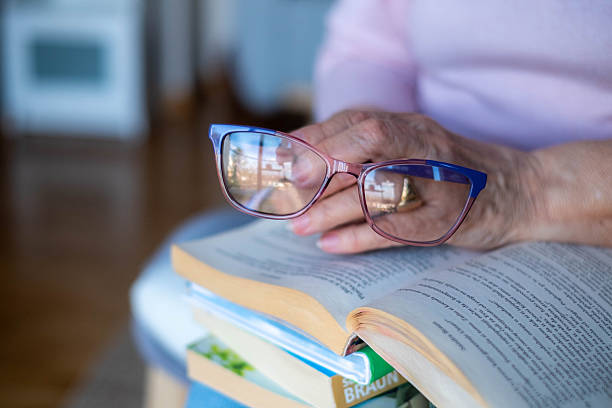 istock Grandma reads books. 2211964585