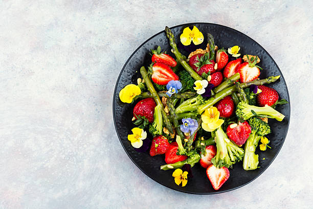 istock Vegetable salad with strawberries. 2211965090