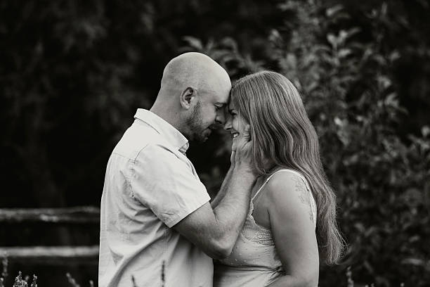 A beautiful, loving couple in a rural setting. Shot with a Canon 5D Mark IV.