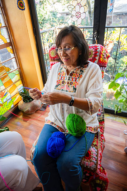 istock Colorful Knitting Lesson: Smiles, Stories, and Handmade Blankets 2211970270
