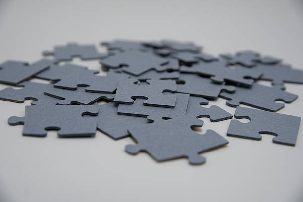 istock monochromatic puzzles in a pile lying on a white background 2211972004