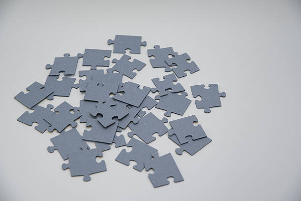 istock monochromatic puzzles in a pile lying on a white background 2211972013