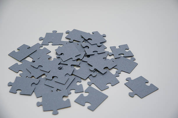 istock monochromatic puzzles in a pile lying on a white background 2211972018