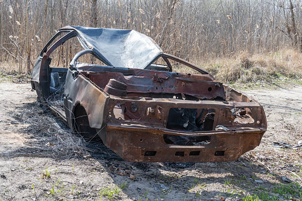 istock Burnt and rusty charred car close-up. 2211972370