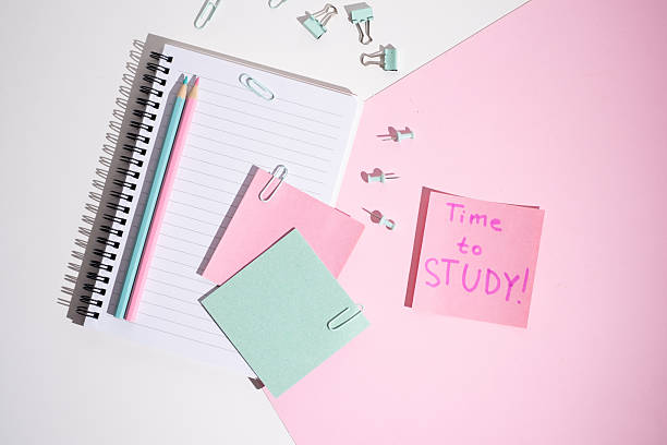 istock Time to study - written message in the workplace. Stationery, notebook, paper clips and sticky notes. Concept of learning 2211975760