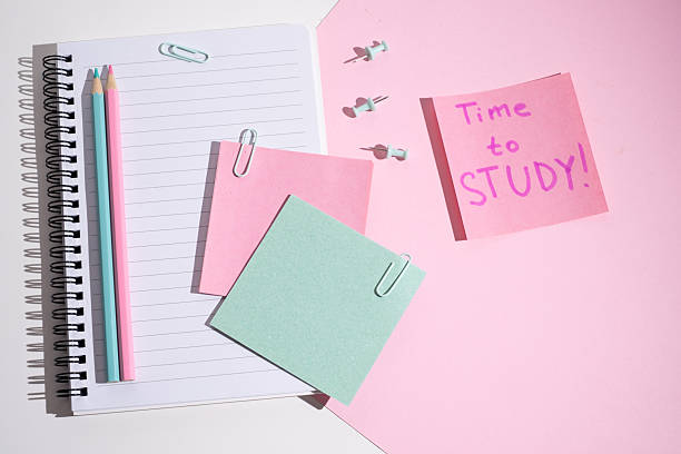 istock Time to study - written message in the workplace. Stationery, notebook, paper clips and sticky notes. Concept of learning 2211975765
