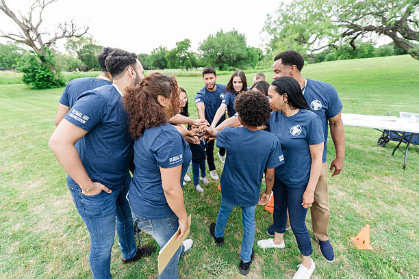 istock Multiracial Group of Adults Teamwork Outdoors in Texas 2211975818