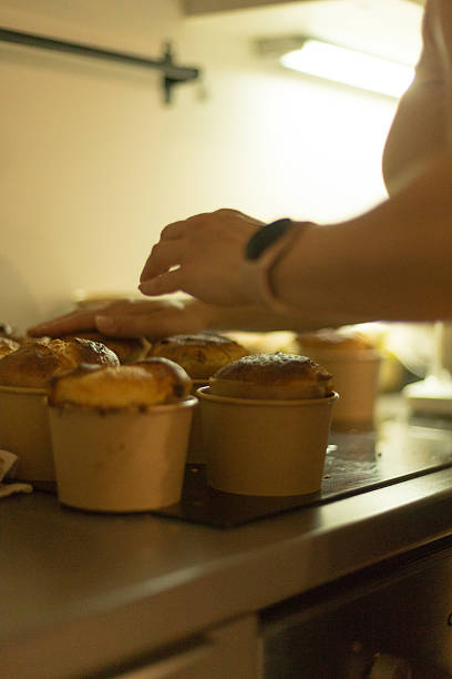 istock Baking Muffins Enjoy Freshly Baked Goods Flavored on Kitchen Counter 2211980138